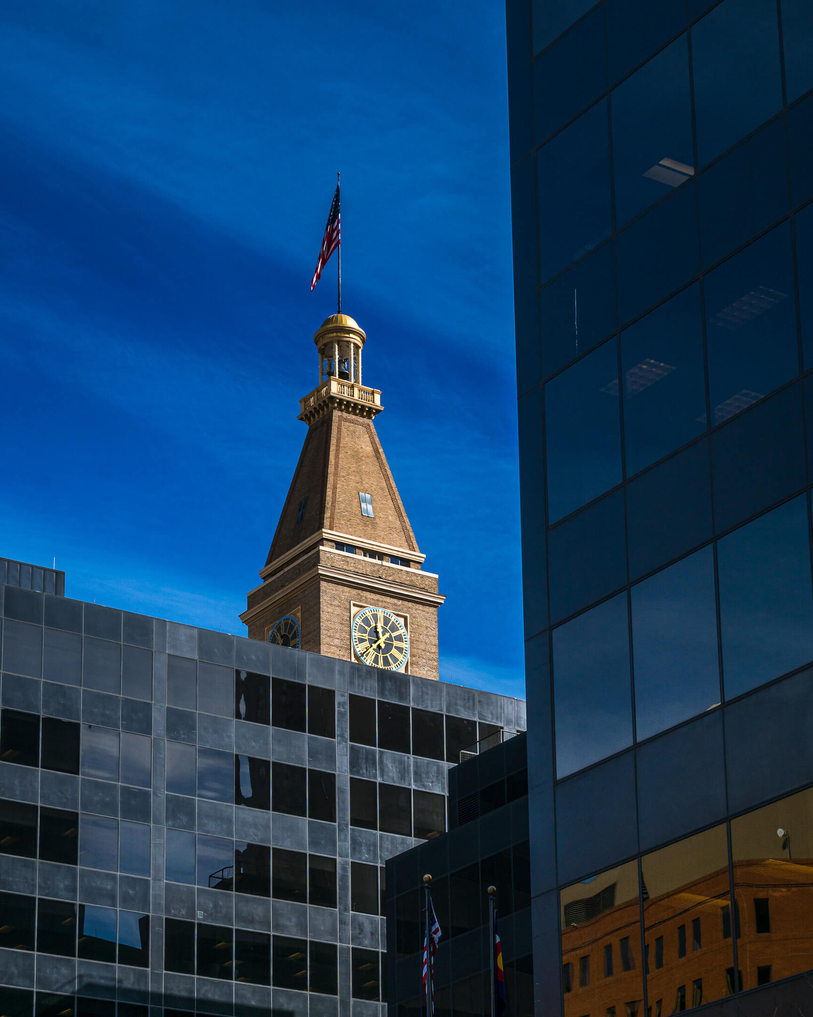Clock Tower Among Skyscrapers